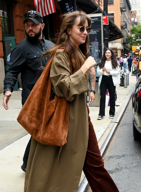 Dakota Johnson has found the perfect pair of adidas sneakers to liven up her fall outfit