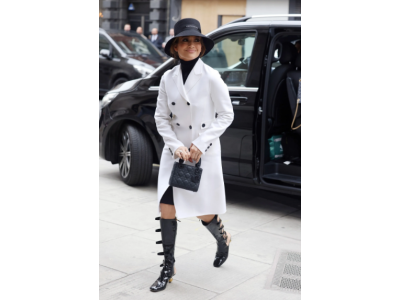 Jennifer Lopez in Dior with a white coat and patent leather "gladiator" boots updates women's look