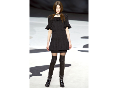 The miniskirt and over-the-knee boots - a timeless classic in seductive style that Chanel transforms with elegance.