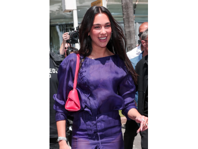 Dua Lipa at the 2026 Cannes Film Festival with a summer look inspired by the 80s.
