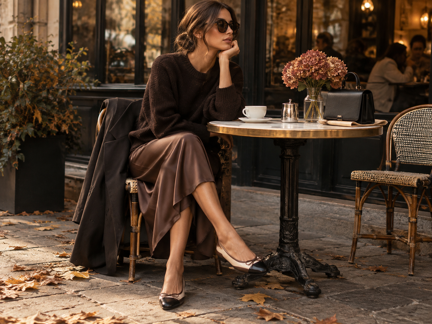 Elegant autumn outfit with ballet flats midi skirt knitwear and a handbag