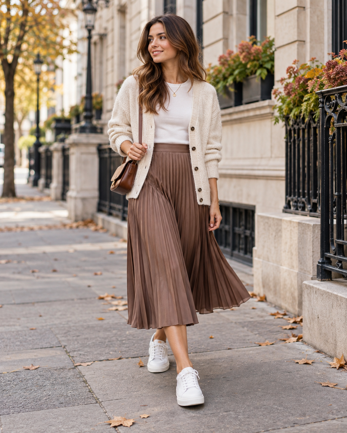 Pleated midi skirt with white T-shirt, white trainers, cardigan and women's bag